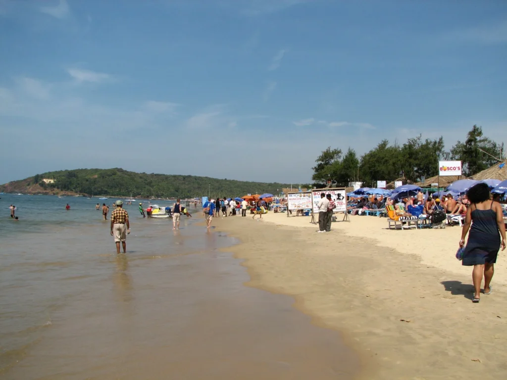 Baga Beach in Goa with visitors enjoying the shoreline, one of the top Things to Do in Goa for beach lovers in 2026.