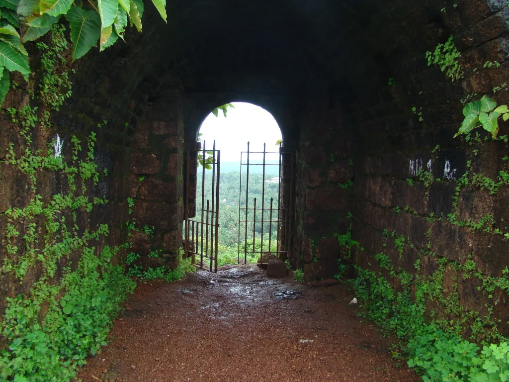 Chapora Fort, one of the top Things to Do in Goa, with Arabian Sea views, historic ruins, and scenic coastal cliffs.