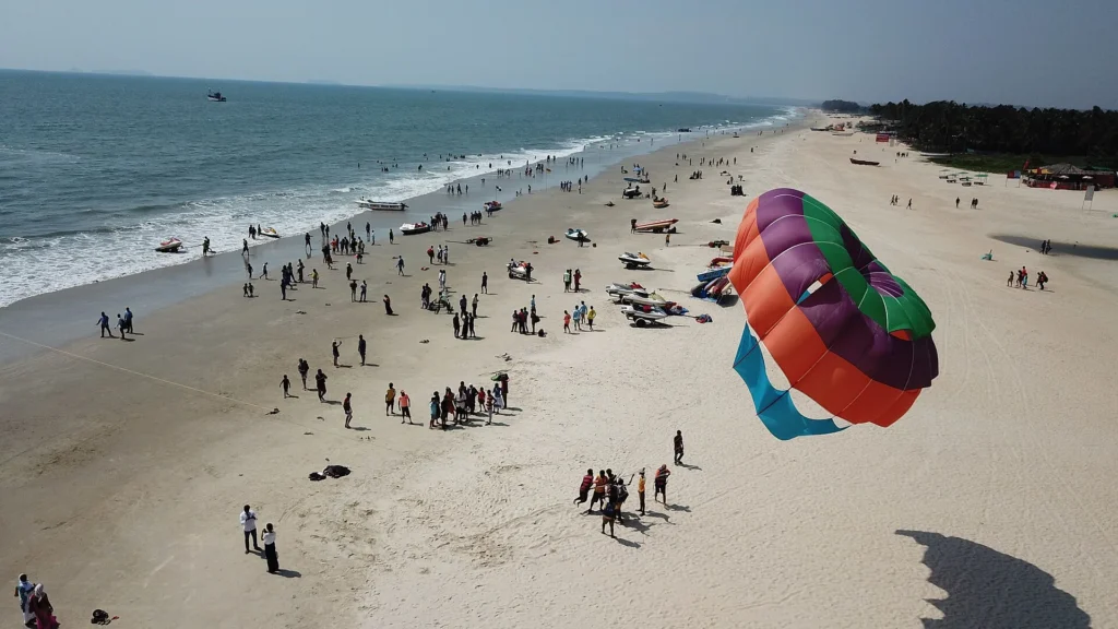 Colva Beach, one of the best Things to Do in Goa, with golden sands, palm trees, and calm Arabian Sea views.