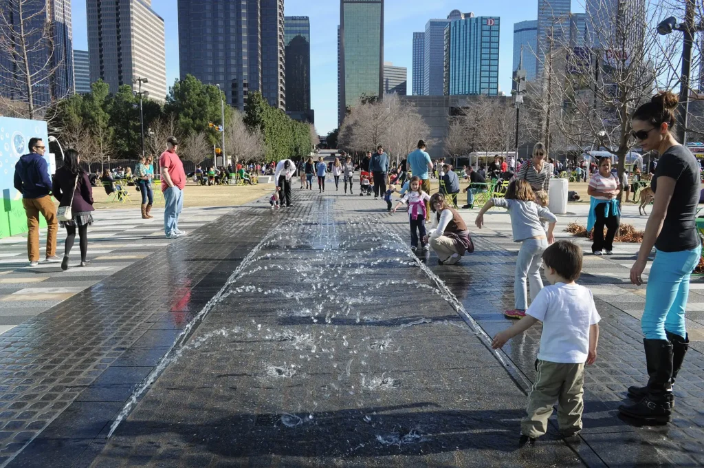 Klyde Warren Park, one of the top Things to Do in Dallas, with green lawns, skyline views, and relaxing outdoor spaces.