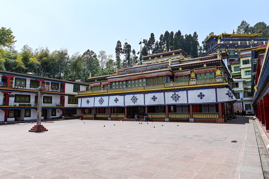 Rumtek Monastery, one of the most spiritual Places to Visit in Sikkim, featuring traditional Tibetan architecture, colorful prayer flags, and scenic Himalayan surroundings.
