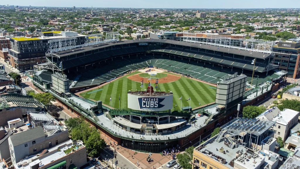 Visitors enjoying a sunny day at Wrigley Field, one of the most iconic attractions and best things to do in Chicago, with historic baseball stadium views, cheering fans, and classic Chicago city atmosphere.
