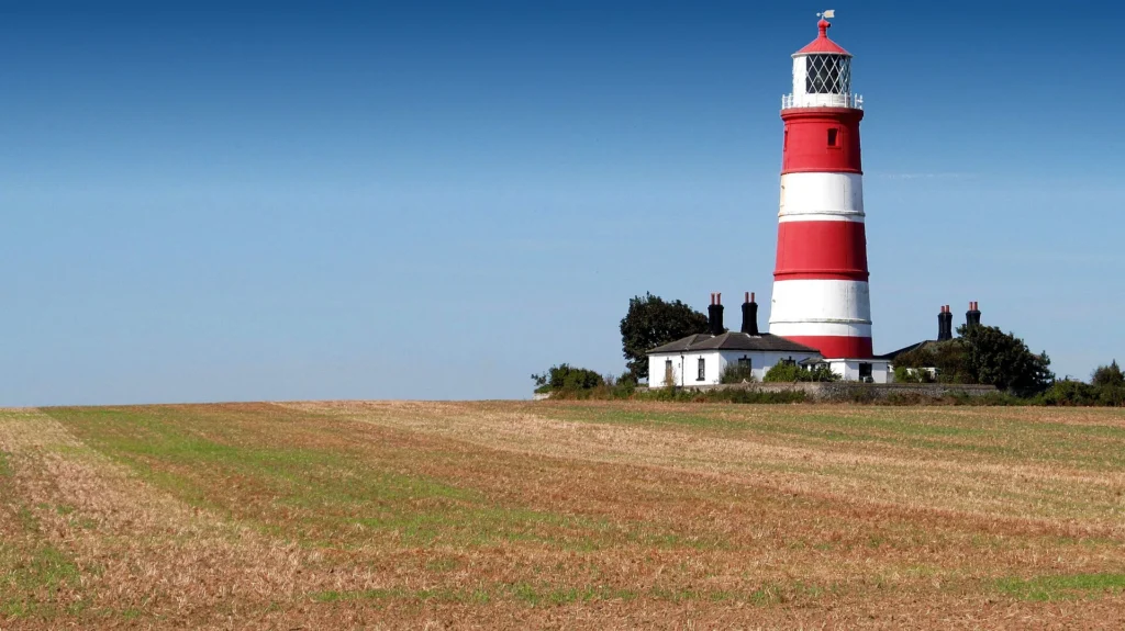 Happisburgh Lighthouse overlooking the Norfolk coast, one of the top Things to Do in Norfolk for scenic coastal views in 2026.