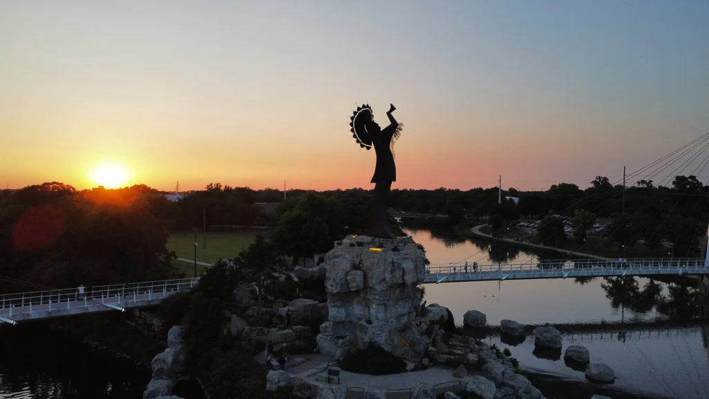 Keeper of the Plains illuminated at sunset in Wichita, one of the top Things to Do in Wichita for history and culture lovers.