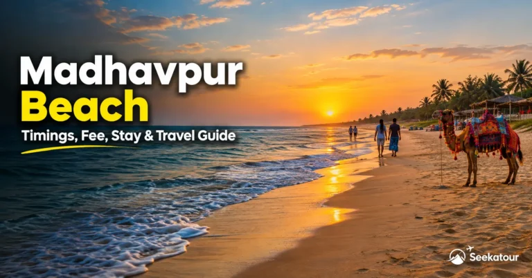 Madhavpur Beach in Gujarat with golden sand, Arabian Sea waves, and a scenic coastline travel view.